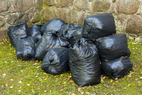 Recycling concrete and masonry waste in a processing facility